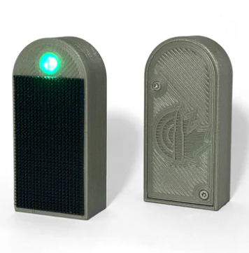 AutoTrickler HitMarker ultra-bright LED hit indicator on steel target visible at 1 mile